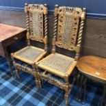 A PAIR OF 19TH CENTURY CARVED OAK HALL CHAIRS