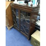 A MAHOGANY TWO DOOR BOOKCASE