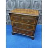 A 20TH CENTURY STAINED WOOD CHEST OF THREE DRAWERS