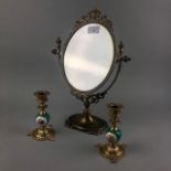 A BRASS DRESSING MIRROR AND A PAIR OF BRASS CANDLESTICKS