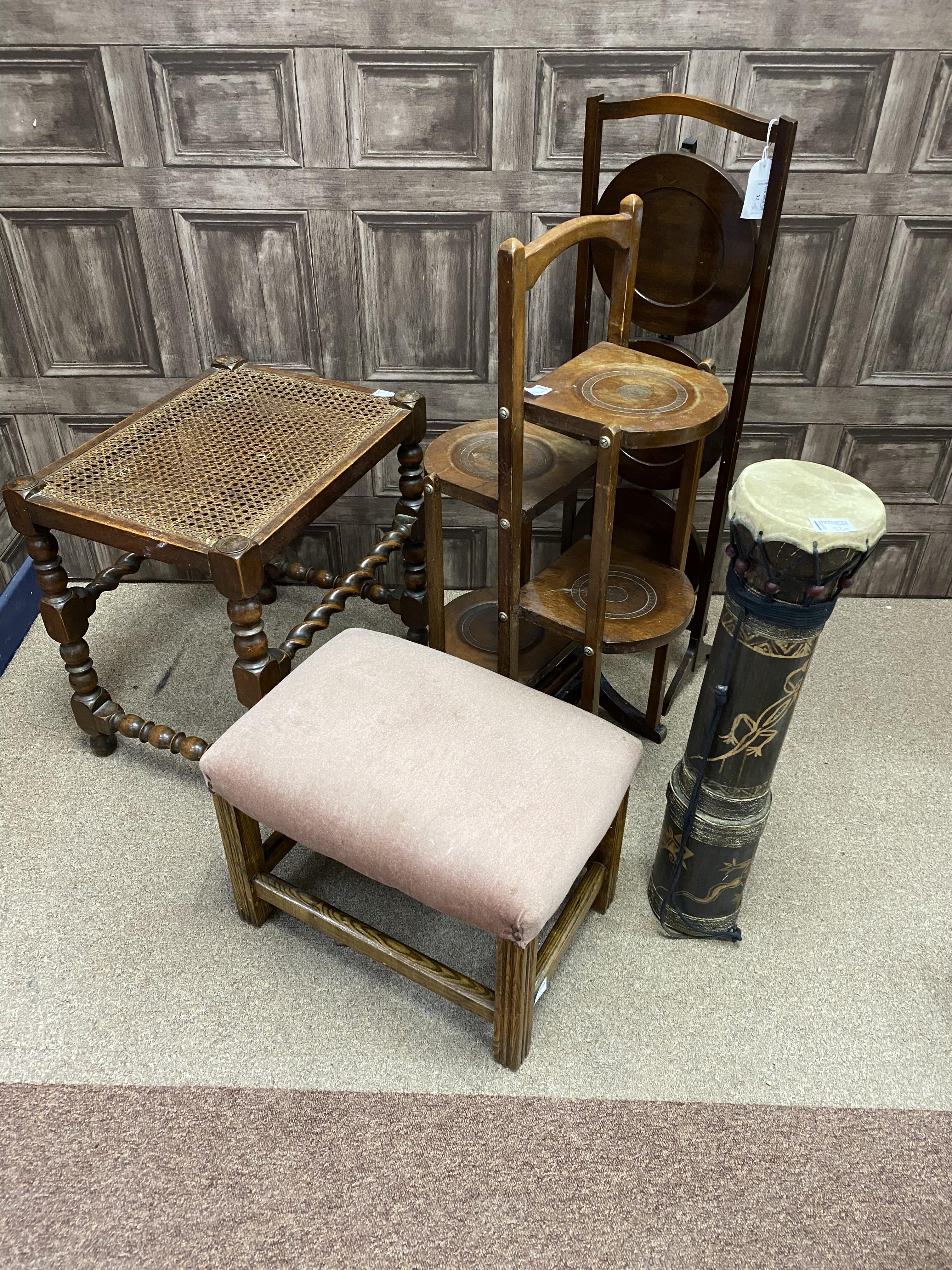 A MAHOGANY THREE TIER FOLDING CAKE STAND, STOOLS AND A DRUM