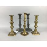 A PAIR OF PEWTER CANDLESTICKS ALONG WITH THREE BRASS CANDLESTICKS
