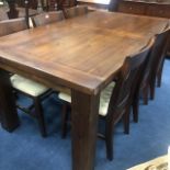 A MAHOGANY DINING SUITE