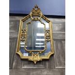 A MODERN WALL MIRROR IN A GILT FRAME