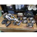 A LOT OF MODEL MOTORBIKES AND A REMOTE CONTROL F1 CAR