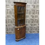 A REPRODUCTION MAHOGANY CORNER CUPBOARD