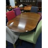 A MAHOGANY DINING TABLE