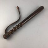 A VINTAGE POLICEMAN'S TRUNCHEON WITH LEATHER STRAP