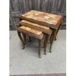 A NEST OF THREE MARBLE TOPPED TABLES