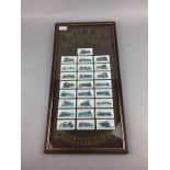 A FRAMED DISPLAY OF WILLS'S CIGARETTE CARDS ALONG WITH A NEWSPAPER AND BOOK