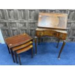 A 20TH CENTURY MAHOGANY LADY'S WALNUT BUREAU, ALONG WITH A NEST OF TABLES