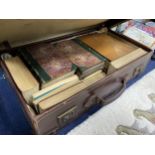 A LOT OF LEATHER BOUND BOOKS AND A VINTAGE SUITCASE