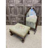 A WALNUT DRESSING MIRROR AND A FOOTSTOOL