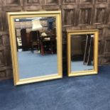 A DECORATIVE RECTANGULAR WALL MIRROR AND A SMALLER WALL MIRROR