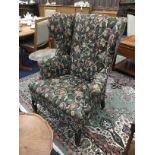 A WING BACK ARMCHAIR