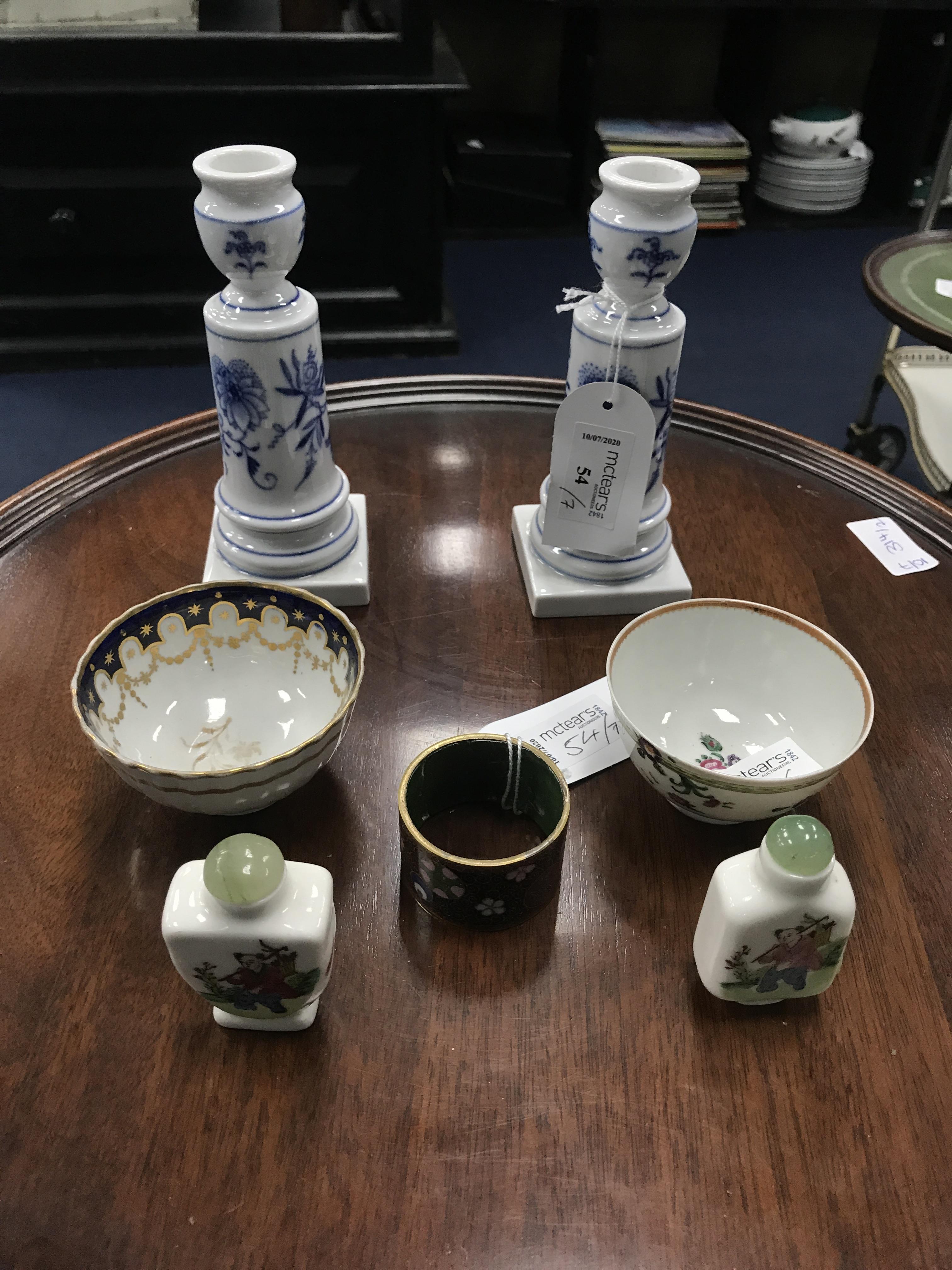 A PAIR OF GERMAN BLUE AND WHITE CANDLESTICKS AND OTHER ITEMS