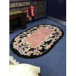 A GROUP OF THREE FLORAL DECORATED OVAL RUGS