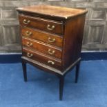 AN EARLY 20TH CENTURY STAINED WOOD FOUR DRAWER MUSIC CABINET