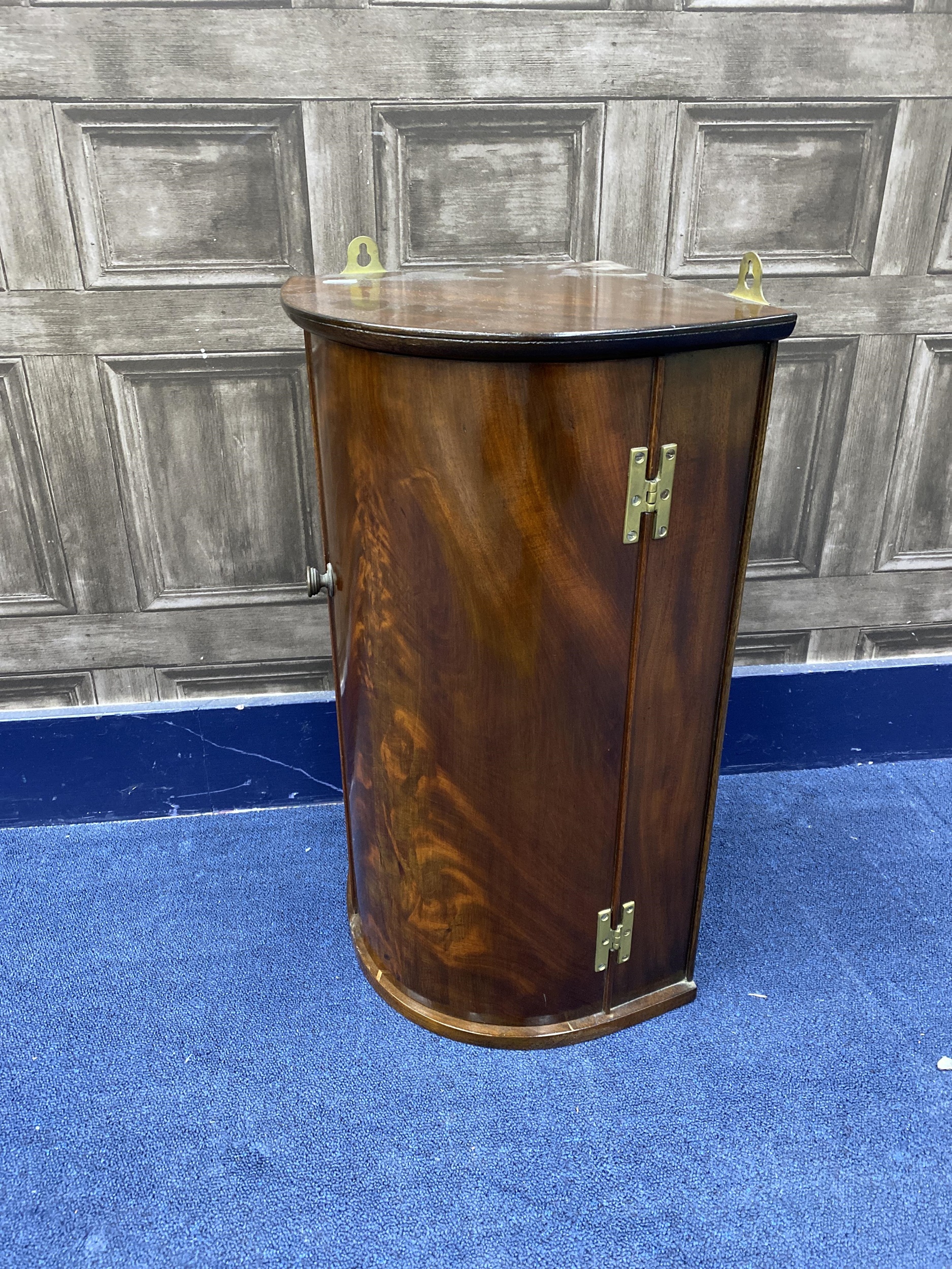 A MAHOGANY WALL MOUNTING BOW FRONTED CORNER CUPBOARD