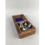 A LOT OF SILVER AND OTHER THIMBLES IN A WOOD BOX