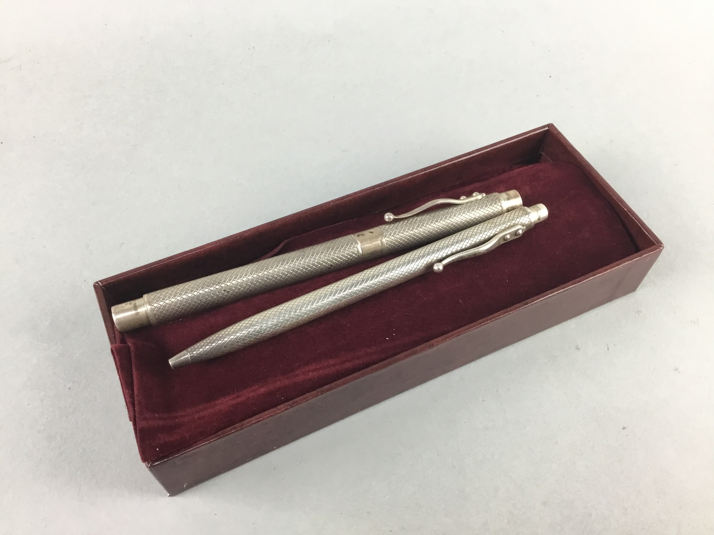 A LOT OF TWO SILVER CASED PENS BY GEORG JENSEN