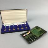 A CASED SET OF SIX SILVER AND ENAMEL TEASPOONS AND ANOTHER