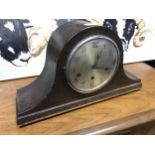 AN OAK CASED MANTEL CLOCK