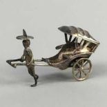 A CHINESE SILVER MODEL OF A RICKSHAW DRIVER