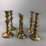 A PAIR OF BRASS CANDLESTICKS AND OTHER CANDLESTICKS