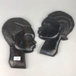 A PAIR OF AFRICAN WALL MOUNTING HEADS ALONG WITH A BUST AND TWO BUDDHAS