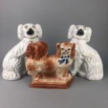 A PAIR OF STONEWARE WALLY DOGS AND ANOTHER