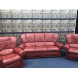 A RED LEATHER THREE PIECE SUITE