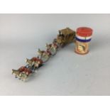 A MONEY BOX AND A BRITAINS MODEL OF CORONATION CARRIAGE