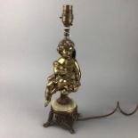 A BRASS CHERUB LAMP