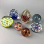 A LOT OF SEVEN GLASS PAPERWEIGHTS