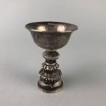 A TIBETAN WHITE METAL LIBATION CUP