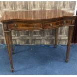 AN EDWARDIAN MAHOGANY SERPENTINE FRONTED SIDE TABLE