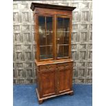 A REPRODUCTION BURR WALNUT BOOKCASE ON CHEST