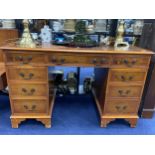 A 20TH CENTURY STAINED WOOD KNEE HOLE DESK