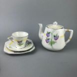 A HAND PAINTED PALISSY PART TEA SERVICE