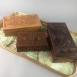 A CARVED WOOD JEWELLERY CASKET, TWO OTHERS AND A SERVING TRAY