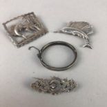 A SILVER BANGLE AND THREE BROOCHES