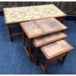 A NEST OF THREE TILE TOPPED TABLES AND A SIMILAR COFFEE TABLE