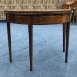 AN EDWARDIAN MAHOGANY DEMI-LUNE FOLD OVER TEA TABLE