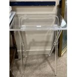 A PAIR OF CLEAR PLASTIC FOLDING OCCASIONAL TABLES