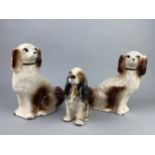 A PAIR OF WALLY DOGS, TWO WALL MASKS AND A CERAMIC SPANIEL