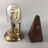 A GERMAN ANNIVERSARY CLOCK AND A VICTORIAN METRONOME