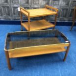 A GLASS TOPPED OCCASIONAL TABLE AND A TWO TIER TROLLEY