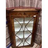 A MAHOGANY CORNER CUPBOARD