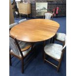 A RETRO DINING TABLE AND SIX CHAIRS